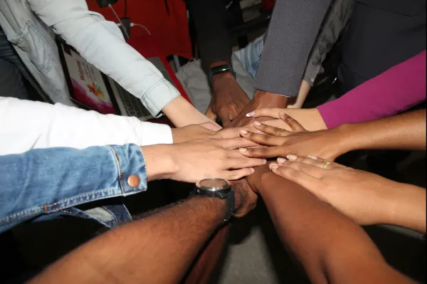 Group of hands joined in circle