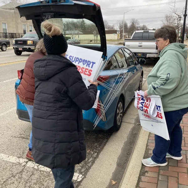 Sturgis RNs with signs